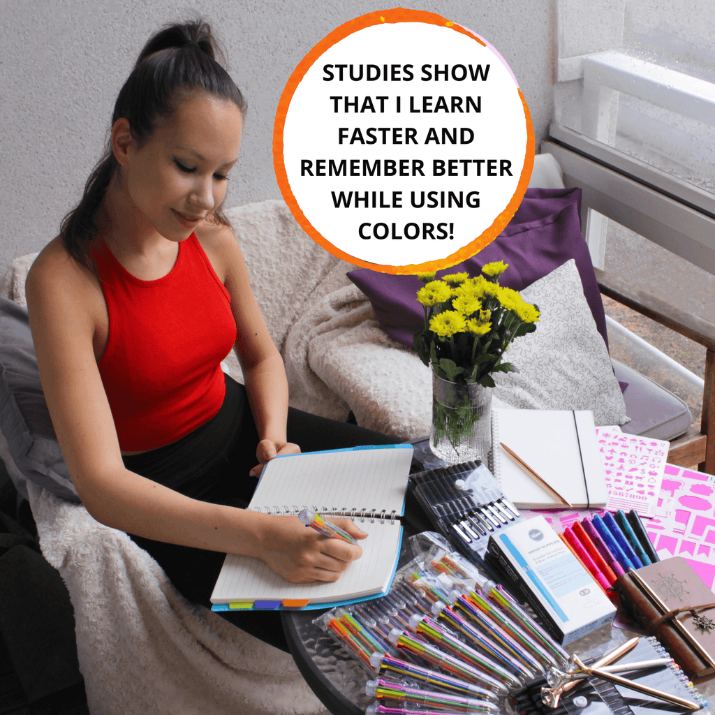 Woman writing with multicolor pens on a table filled with stationery supplies, promoting enhanced learning with colors.