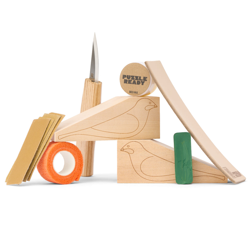 Wood carving knife, cedar bird blocks, sharpening compound and sandpaper